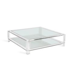 two clear glass tables with one on the bottom and one on the top, both stacked together