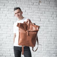 Genuine leather Rolltop Backpack with top zipperDimensions:Rolled height: 16 inches (40cm)Total height: 25 inches (63 cm)Width: 16 inches (40 cm)Depth: 7 inches (17 cm)Also, the backpack has two outside pockets and one inside pocket.Inside pocket:Height: 8 inches  (20.5 cm) Width: 8 inches  (20.5 cm) Leather Backpack With Large Capacity, Everyday Leather Standard Backpack, Leather Backpack For On-the-go, Modern Leather Backpack For On-the-go, On-the-go Leather Backpack, Leather Everyday Backpack, Modern Leather Backpack, Leather Backpack With Large Capacity For Everyday, Leather Backpack For Everyday Use