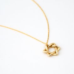 ❧ Product Overview and Key Features  Crafted with precision, this delicate Star of David Necklace in 14K Solid Gold is an emblem of faith and fashion. Perfect for the modern woman, this dainty  Jewish Star necklace is a unique blend of spiritual symbolism and contemporary style. Made from 14k yellow gold, this delicate star of David charm doubles as a star necklace, making it a versatile addition to your jewelry collection. *Material & Color Options: 14k Yellow Gold, 14k White Gold, 14k Rose Gol Minimalist 14k Gold Star Of David Necklace, Fine Jewelry Star Of David Necklace For Formal Occasions, 14k White Gold Star Of David Necklace, Formal Star Of David Fine Jewelry Necklace, Classic Star Of David Jewelry For Gift, Elegant Star Of David Jewelry For Formal Occasions, Minimalist Yellow Gold Star Of David Necklace, Classic Star Of David Necklace As Gift, Classic Star Of David Necklace For Gift