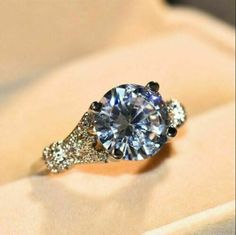 an engagement ring with diamonds on it