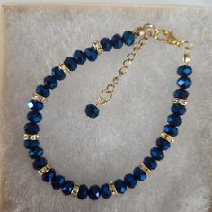 Blue Color Glass Crystal Faceted Bracelet ,Blue Beads, Blue Faceted Beads, Faceted Round Beads, Gold Rhinestone Spacers, Gold Clasp Approximately 7 inches, make sure this will fit your wrist. Beads used are  6 mm in diameter  All my bracelets are handmade by me. Please note -  I do my very best to give you accurate measurements and descriptions All my jewelry is delivered in a gift box and beautiful organza gift bag, perfect for keeping your jewelry safe, or ready to give if it is a gift! Colors could vary due to lighting * see more brackets at https://decowrist.etsy.com/ No refunds or exchanges Decals Codes, Bracelet Craft, Bloxburg Decals, Bracelet Craft Diy, Beaded Jewlery, Jewelry Safe, Beading Ideas, Jewelry Making Project, Bracelet Blue