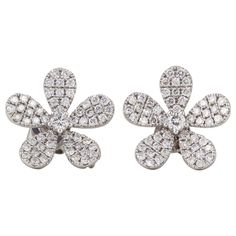 A beautiful design, over a carat of sparkle! 1.08 carats of F color VS clarity round brilliant cut diamonds set in 18k white gold. Approx .60 inches at its widest point. Luxury Flower Shaped Diamond Earrings, Luxury Flower Shaped Diamond Earrings With Accents, Luxury Flower-shaped Diamond Earrings With Accents, Luxury White Flower Diamond Earrings, Formal Diamond Earrings With Flower Shape, Diamond Flower Shaped Earrings For Formal Events, Diamond Flower Shaped Earrings For Formal Occasions, Flower-shaped Brilliant Cut Diamond Earrings, Diamond White Flower-shaped Diamond Earrings