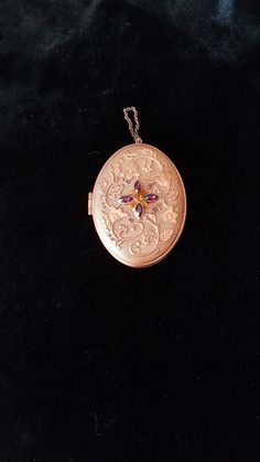 In mint condition, this unique locket box  weighs a hefty 4.7 oz. and would need a strong chain to wear with it.  I think perhaps it was made more as a display item or for collectors. So, grab this now if you are a collector or just love the unique look of this piece. Victorian Medallion Jewelry With Hallmark, Formal Victorian Hallmarked Locket Necklace, Formal Hallmarked Pendant Locket Necklace, Rose Gold Locket Necklace For Formal Occasions, Formal Rose Gold Locket Pendant Necklace, Formal Rose Gold Locket Necklace, Collectible Ornate Pendant Locket Necklace, Antique Engraved Purple Jewelry, Antique Pendant Locket Necklace For Formal Occasions