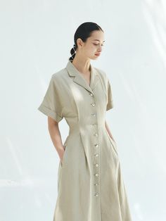 This is a trendy and modern dress by MOHAN that is made out of high quality and sturdy material. With distinctive mood of the design and comfortable wear, you can style it for your casual daily outfit.- Tuck detail on the waistline- Flared silhouette- Minimal and feminine mood Elegant V-neck Relaxed Fit Shirt Dress, Casual Dresses With Button Cuffs In Relaxed Fit, Casual Button-up Office Dress, Summer Knee-length Shirt Dress With Button Cuffs, Elegant Button-up Shirt Dress With Relaxed Fit, Elegant Relaxed Fit Button-up Shirt Dress, Summer Mid-length Shirt Dress With Button Closure, Summer Workwear Shirt Dress With Button Cuffs, Chic Short Sleeve Shirt Dress With Button Closure