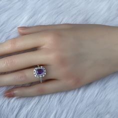 Details: Materials: Amethyst Gemstone, White Zircons, S925 Sterling Silver Plated with 18K White Gold Color: Purple Shape: Retangular Size: Adjustable and fitable for all Descriptions: This elegant ring has a 7x5mm amethyst and forty-four white zircons. Other than the stones, the ring is made out of S925 sterling silver plated with 18K white gold. A ring of small zircons outlined the amethyst. A circle zircon alternates with an oval zircon to create a pattern for the second outline of the ring. Elegant Amethyst Crystal Ring With Accent Stones, Elegant Amethyst Crystal Ring With Center Stone, Elegant Amethyst Crystal Ring With Prong Setting, Elegant Purple Crystal Ring With Accent Stones, Elegant Purple Crystal Ring With Prong Setting, Elegant Cubic Zirconia Gemstones For Promise Ring, Elegant Amethyst Birthstone Ring In Cubic Zirconia, Elegant Amethyst Cubic Zirconia Birthstone Ring, Elegant Amethyst Birthstone Crystal Ring