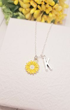 It's more than charm, it's a Sunflower necklace This Cute Sunflower chain necklace comes with a Gold Sunflower charm and a choice of sterling silver chain or gold chain. You can get these personalized necklaces in any length, so please contact me via Etsy Conversations if you need any size. This minimalist and dainty celestial necklace is made with a high-quality material that is eco-friendly, durable, and anti-inflammatory. It won't leave your skin green due to marks. Moreover, the weight of the necklace is quite appropriate, and they come with a Lobster Clasp to provide you a full-day comfort without any hassle. This adult necklace makes the perfect gift for your loved ones on special occasions like anniversaries, bridal showers, engagements, and graduation parties. Silver Jewelry With Birth Flower Initial Pendant, Silver Jewelry With Initial Pendant And Birth Flower, Adjustable Silver Flower Charm Necklace, Silver Adjustable Flower Charm Necklace, Adjustable Silver Flower Charm Necklaces, Silver Adjustable Flower Charm Necklaces, White Sterling Silver Charm Necklaces With Flower Charm, Dainty Sterling Silver Flower Pendant Charm Necklace, White Sterling Silver Charm Necklace With Flower