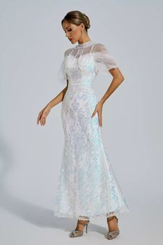 As a product expert, I am pleased to introduce the Selina Maxi Dress - perfect for any special event. This stunning dress features evening dresses, gala ballgowns, and a sparkling sequin design that will surely make you stand out. With its elegant and versatile design, it's the perfect choice for cocktail parties, graduation, and other formal occasions. Feel confident and stylish in this must-have dress. Material: Polyester Hostess Gown, Silver Sequin Top, Grace Dress, Glitter Wedding Dress, Bandage Midi Dress, Sequin Design, Fish Tail, Floral Shirt Dress, Puff Sleeve Dresses