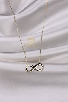 "ABOUT PRODUCT This 14K gold Infinity necklace is beautifully designed and hand crafted with our associates to make this a special gift for your loved ones. Knowing the value of our customers, We prepare each piece with extra care and attention. ITEM DETAILS Material: 14K Gold Approx: 2,85 gr Available colors: Gold, Rose Gold, White Gold Available Sizes: 14\" to 20\" ✪ 14k Solid Gold ( Certification will be included with your order ) ✪Available 14K White, Yellow, Rose Gold (also in 10, 18K) 🛠 Y Gold Infinity Necklace For Gift, Minimalist Infinity Necklace With Delicate Chain, Minimalist Infinity Clavicle Chain Necklace, Modern Sterling Silver Infinity Necklace, Minimalist Gold Infinity Necklace, Minimalist Infinity Gold Necklace, Infinity Shape Fine Jewelry Necklace For Formal Occasions, Elegant 14k Gold Infinity Necklace, Elegant 14k Gold Infinity Jewelry