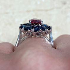 This ring features a 1.51 carat rubellite set in prongs, surrounded by a cluster of sapphires prong-set in a floral design. The total carat weight of the sapphires is 2.98 carats. This ring is 18k white gold.
The dimensions of the rubellite are approximately 9.10mm x 6.51mm x 3.99mm.
This ring can be resized to any finger size at no extra cost.
If you have any questions about the Koi ring, please feel free to contact us. Multi-stone Cluster Ruby Ring, Multi-stone Ruby Cluster Ring, Ruby Multi-stone Cluster Ring, Cluster Sapphire Ring With Accent Stones, Formal Cluster Ruby Ring With Gemstone, Elegant Red Multi-stone Sapphire Ring, Fine Jewelry Cluster Ruby Ring, Cluster Ruby Ring, Estate Diamond Jewelry