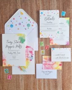 the wedding stationery was done in watercolors, with colorful dots and confetti