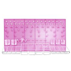 a pink pegboard with glasses and other items on it's sides, in front of a white background