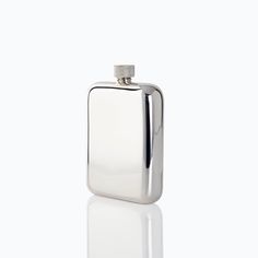 a stainless steel flask shaped like a hip flask with a silver cap on the top