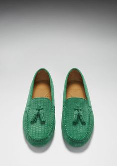 Hugs & Co. emerald tasselled loafer driving shoes for women. Moccasin style driving loafers in luxurious emerald suede upper embossed with a Gecko print pattern and lined with a soft leather for extra comfort. Made in Portugal 100% Suede Upper featuring a 100% Leather Lining Rubber studded sole Classic Green Tassel Loafers With Round Toe, Luxury Green Loafers For Formal Occasions, Green Slip-on Moccasins With Leather Sole, Green Leather Sole Slip-on Moccasins, Luxury Slip-on Tassel Loafers With Textured Sole, Classic Green Tassel Loafers With Leather Sole, Green Slip-on Formal Loafers, Luxury Tassel Loafers With Textured Sole And Round Toe, Green Formal Loafers For Spring