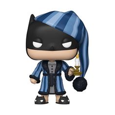 the batman movie pop vinyl figure is dressed in blue and black striped clothes, holding a glass