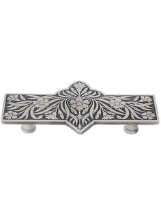 an ornate metal door handle on a white background