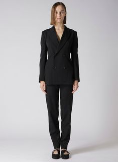 An exquisite wool gabardine jacket characterized by a beautifully tailored waistline. The slightly tight design accentuates the waist, while the supple fabric highlights the elegant drapery, particularly in the back. This piece combines material texture and sophisticated design for an overall elegant appearance. - Wool gabardine material with elegant drapery - Slightly tight waistline design - Highlights the back's beautiful silhouette - Model wears sample item; actual size and texture may vary Elegant Office Pantsuit With Structured Boning, Elegant Structured Outerwear For Office, Evening Tailored Pantsuit With Structured Boning, Single Breasted Pantsuit For Formal Winter Occasions, Elegant Double Breasted Suit For Winter Office Wear, Elegant Double Breasted Suit For Office Wear In Winter, Formal Long Sleeve Pantsuit With Structured Boning, Long Sleeve Pantsuit With Structured Boning For Office, Elegant Double Breasted Suit With Suit Collar For Fall