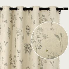 a curtain with a flower pattern hanging from it's rod - end, next to an image of a yellow bird