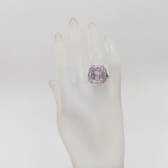 Beautiful 22.65 ct. pink kunzite emerald cut with 0.51 ct. good quality white diamond rounds.  Handmade in 18k white gold.  Ring size 7.5.  Metal:White Gold Stone: White Diamond,Kunzite Stone Cut: Emerald Cut  Dimensions reference the ring size and are not specific to the ring itself. Exact ring dimensions are not provided. Please reach in the seller Q&A for questions. Luxury Pink Amethyst Ring For Formal Occasions, Formal Pink Amethyst Ring, Luxury Pink Amethyst Ring With Prong Setting, Pink Baguette Cut Diamond Ring For Formal Events, Formal Pink Amethyst Ring With Prong Setting, Formal Kunzite Ring With Prong Setting, Elegant Pink Kunzite Rings, Formal Kunzite Jewelry With Prong Setting, Formal Silver Kunzite Jewelry