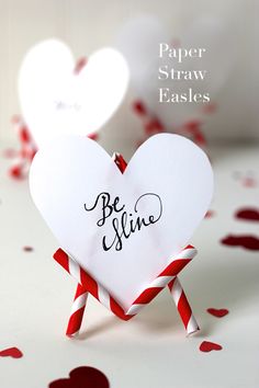 two paper straws shaped like hearts with the words be silly on them