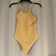 Small Nwt A&F Yellow Ribbed Body Suit Great Thick Material Tts Yellow Stretch Solid Color Top, Fitted Plain Bodysuit For Summer, High Stretch Yellow Tops For Summer, Yellow Stretchy Top For Summer, Summer Plain Bodysuit, Yellow Seamless Swimwear For Spring, Plain Yellow Top For Spring, Yellow Stretch Sleeveless Bodysuit, Spring Loungewear Bodysuit In Solid Color