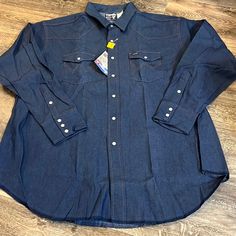 Nwt Vintage Wrangler Shirt....See Photos For Measurements Western Style Medium Wash Shirt With Pockets, Western Style Denim Blue Cotton Shirt, Long Sleeve Denim Shirt For Rodeo, Denim Blue Tops For Rodeo, Classic Dark Wash Shirt For Rodeo, Western Denim Blue Tops With Pockets, Blue Shirt With Pockets For Rodeo, Western Style Denim Blue Shirt For Rodeo, Denim Blue Long Sleeve Shirt For Rodeo