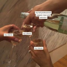 three people are toasting with wine glasses