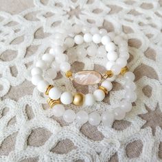 Gorgeous white stack features: -milky white with gold bead and spacers -matte white jade with matte gold hematite and gold spacers -white moonstone paired with a pink moonstone pendant. Pick one or all 3 of them. Choose your bracelet choice and your size from drop box. All your items will be packaged and shipped in a cotton filled kraft box. White Hand-strung Stretch Bracelet Gift, Adjustable White Crystal Bracelet With Gemstone Beads, White Stackable Crystal Bracelet As Gift, Elegant White Stretch Bracelet With 8mm Beads, Stackable White Crystal Bracelet Gift, White Stackable Crystal Bracelet Gift, Adjustable White Stackable Stretch Bracelet, White Bracelets With 8mm Adjustable Beads, White Gemstone Beads Bracelet As Gift