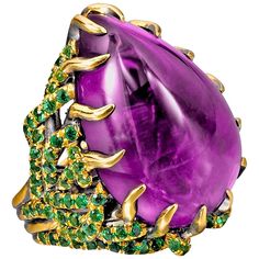 This gorgeous ring, inspired by the true story of Marie Antoinette, was created in New York City by our expert goldsmith. Creating this labor-intensive piece took over one month, with each pavé tsavorite being set by hand by a gem setter who has truly mastered his craft. The combination of purple amethyst and green garnet is a symbol of royalty; royal women are the inspiration for many of Wendy's designs. The creeping, thorn-like prongs convey the way Marie Antoinette was drawn into a frightenin Amethyst Cocktail Ring, Yellow Gold Cocktail Ring, Amethyst Birthstone, Green Garnet, Purple Reign, Gold Cocktail Ring, Contemporary Ring, All Things Purple, Amethyst Jewelry