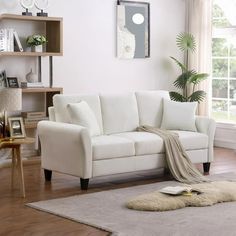 1. Elevate your living room with this modern velvet couch, featuring a sleek design and two coordinating pillows for added comfort. 2. Add a touch of luxury to your space with this 78-inch wide velvet couch, perfect for seating three people comfortably. 3. Create a stylish focal point in your living room with this white velvet couch, complete with durable plastic legs for added stability. 4. Update your home decor with this elegant 3-seater sofa, crafted from high-quality velvet for a sophistica Boucle Couch, Sofa Contemporary, Hamptons Modern, Long Sofa, Soft Spring, Velvet Couch, Rolled Arm Sofa, Comfy Sofa, White Sofas