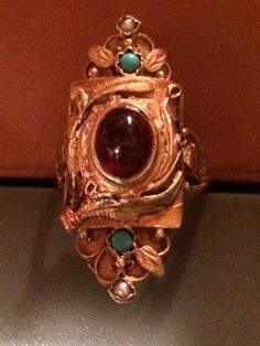 "Fine jewelry from the Turn of the Century. Stunning example of Victorian artistry at it's finest. The detail work present in this 14k yellow & rose solid gold handmade antique ring is superb. High quality center cabochon stone that I believe is a garnet. Size 5 1/4. Length 1 1/4\" x Width 1/2\". Part of a collection currently being sold." Ceremonial Oval Cabochon Rings, Antique 14k Gold Signet Ring With Cabochon, Antique Rose Gold Jewelry For Ceremonial Occasions, Victorian Cabochon Ceremonial Jewelry, Antique Hallmarked Oval Cabochon Rings, 14k Gold Art Nouveau Ring Jewelry, Luxury 14k Gold Ruby Cabochon Ring, Art Nouveau 14k Gold Jewelry With Intricate Design, Formal Rose Gold Cabochon Ring