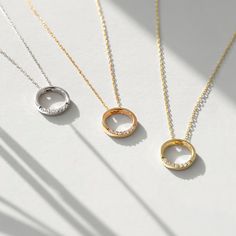 "This circle pendant necklace is your go-to piece of every day, any day. With diamond drops on the bottom side, you'll shine any time you want. Choose your special day or just a random Friday to gift yourself or your loved ones. F E A T U R E S * Made to Order. * Gold KT: 14K * Choice of Gold Color: Yellow Gold, Rose Gold, White Gold * Gem Stone: Genuine Diamond * Diamond-Cut: Round * Diamond Carat: 0.02 ct * Pendant Height: 9 mm / 0.35 inch * Pendant Width: 9 mm / 0.35 inch * Diamond Color-Clar Circular Necklaces With Diamond Accents For Gifts, Gift Open Circle Necklace With Diamond Accents, Circular Diamond Necklace For Gifts, Circular Diamond Necklace Gift, Everyday Necklace With Diamond Accents And Round Pendant, Diamond Circle Necklace, Open Circle Necklace, Karma Necklace, Round Pendant Necklace