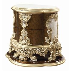 an ornately decorated wooden box with gold trimmings and white marble inlay