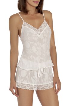 Lace Sleepwear With Delicate Straps And V-neck, Lace V-neck Camisole For Vacation, Lace V-neck Camisole For Bedtime, Sleepwear With Lace Trim And Spaghetti Straps, Lace Sleepwear With Spaghetti Straps For Pajama Party, V-neck Lace Trim Camisole For Pajama Party, Elegant Lace Trim Sleepwear For Vacation, White Camisole Sleepwear With Adjustable Straps, Lace Camisole Sleepwear For Loungewear