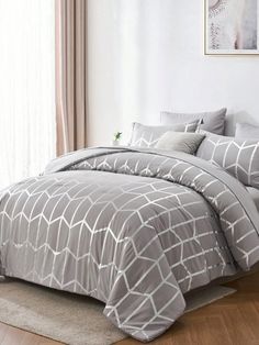 the comforter is made up in grey and white