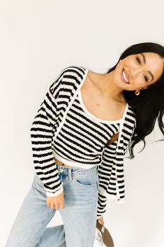 it’s a tank, it’s a cardigan – it’s a tank + cardigan combo. detailed with a retro-inspired black + white stripe pattern, this cropped sweater tank + cardigan set is a spring outfit staple. wear them together or separately to elevate any outfit. black + white // two piece set, scoop neckline, buttons, drop shoulder paired with our sicily distressed denim model is 5'8" + wearing a small measurements are approximate + taken while laying flat small : bust 44” length 18.5” tank: small : bust 28” len White Two Piece Set, White Two Piece, Cardigan Set, Fall Staples, Clothing Staples, Outfit Black, Sweater Tank, Sweater Set, Striped Sweater