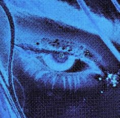 an eye is reflected in the reflection of another person's face, with blue light coming from behind it