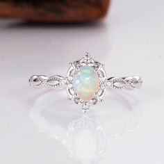 Gorgeous vintage inspired Australian opal ring ✧ Sterling silver (925) or 14K Gold or 14K Rose gold ✧ Accented with natural quartz diamonds This gorgeous, timeless ring features a stunning Australian opal and natural crystals. ✧ Stone: Natural Gemstone  ✧ Shape: Oval ✧ Carat Weight: 0.53ct. (approx.) ✧ Gemstone Origin: Australia  ✧ Sizes 2.75-12.25 ✧ This ring set will arrive ready to gift in a Kherish Box. ✧ Due to the nature of the handmade process, each piece may slightly vary in color, size, Australian Opal Ring, Timeless Ring, Fairy Wedding, Rose Gold Accents, Opal Ring Gold, Gold Ring Stack, Opal Earrings, Opal Ring, Wedding Board