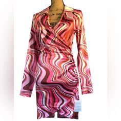 Stunning Dress, Long Sleeves, Lightweight, Feels/Looks Like Satin! Has Stretch If Needed. Side Ruched Gathering, Somewhat Of A Wrap Style, Just A Sexy Look And Feel To It. Size Us 6 Ptp Is 17” Length Is 35” From A Smoke Free Environment Please Feel Free To Ask Any And All Questions As All Sales Are Final, Thank You ! Flirty Printed Mini Dress, Printed Mini Dress For Date Night, Printed V-neck Mini Dress For Date Night, Printed Mini Dress For Night Out, Trendy Stretch Printed Dresses, Multicolor Fitted V-neck Mini Dress, Fitted Multicolor V-neck Mini Dress, Long Sleeve Dresses With Abstract Print For Party, Chic Fitted Printed Dresses