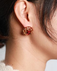 Introducing our Regal Artisan Design Faux Ruby Stud Earrings. These earrings feature an elegant and vintage-inspired design with both red and green hues. Crafted to evoke a sense of uniqueness and sophistication, they showcase a blend of regal charm and artisan craftsmanship. Perfect for those seeking a distinctive and refined accessory to complement their style with a touch of flair. Size: 2.3cm x 2.3cm Red Clip-on Earrings For Wedding, Red Clip-on Earrings For Party, Elegant Red Single Clip-on Earring, Red Single Earring For Formal Occasions, Red Clip-on Earrings For Evening, Vintage Red Clip-on Earrings For Evening, Red Clip-on Earrings For Anniversary, Vintage Red Clip-on Earrings For Anniversary, Red Vintage Clip-on Earrings For Anniversary