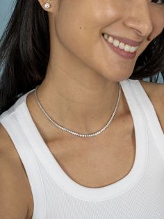 The tennis necklace that doesn't flip! Tennis jewelry is a piece for a lifetime! This tennis necklace is the ultimate symbol of luxury. The leMel tennis necklace is designed not to flip, so your diamonds can sparkle all day long! It can make a statement on its own, but we love to layer our dainty gold jewelry! Add any piece of initial jewelry or even a paperclip chain necklace! Also available with eternity diamond coverage. For custom orders or quotes please email: hello@shoplemel.com White Timeless Tennis Necklace With Single Cut Diamonds, Timeless White Tennis Necklace With Single Cut Diamonds, White Gold Tennis Necklace With Single Cut Diamonds, Timeless Single Strand Diamond White Tennis Necklace, White Gold Tennis Necklace With Single Strand, White Gold Single Strand Tennis Necklace, Timeless White Brilliant Cut Tennis Necklace, Fine Jewelry White Diamond Cut Tennis Necklace, White Diamond Single Strand Tennis Necklace