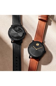 Simple and streamlined, the iconic Museum dot sits front and center on the index-free face of this everlasting timepiece you'll love wearing. 40mm case; 21mm band width Swiss quartz movement K1 mineral crystal face Stainless steel with black ionic plate/leather Swiss made Modern Brown Watches With Rectangular Dial, Modern Brown Watch With Rectangular Dial, Modern Round Leather Watch Accessories, Luxury Everyday Watches, Modern Brown Analog Watch, Modern Brown Analog Display Watch, Modern Brown Leather Watch, Brown Leather Watches With Diamond Hour Markers, Classic Matte Black Watch For Business