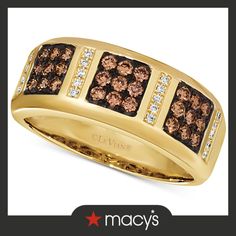 a gold ring with brown and white diamonds