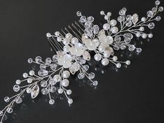 Wedding White Pearl Clear Crystal Silver Bridal Side Hair Comb. HAIR COMB size approx. 7 inches (17.8cm) wide, and 2.63 inches (6.7cm) high including comb. This item is ready to ship HAIR ACCESSORIES SECTION: https://www.etsy.com/shop/LanaChayka?ref=seller-platform-mcnav&section_id=22670998 BRIDAL EARRINGS SECTION: https://www.etsy.com/shop/LanaChayka?ref=seller-platform-mcnav&section_id=11638940 BRIDAL JEWELRY SETS SECTION: https://www.etsy.com/shop/LanaChayka?ref=seller-platform-mcnav&section_ Bridal Side Hair, Pearl Bridal Hair Comb, Wedding Sides, Pearl Bridal Comb, Pearl Bridal Hair, Bridal Hair Combs Pearl, Hair Piece Wedding, Silver Hair Comb, Side Hair