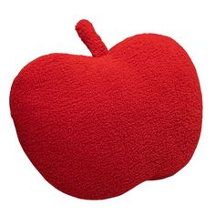 an apple shaped pillow is shown on a white background, with the top half in red