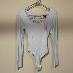 Brand New Condition. Super Cute And Pairs Wonderfully With Both Jeans And Skirts. Says Xs But Can Fit A M. Price Is Negotiable. Comment For Measurements! Casual Backless Bodysuit For Spring, Casual Backless Spring Bodysuit, Trendy Blue V-neck Bodysuit, Light Blue Stretch Bodysuit, Blue Backless Bodysuit For Night Out, Chic Blue Stretch Bodysuit, Spring Light Blue Stretch Bodysuit, Blue Backless Bodysuit For Spring, Casual Fitted Light Blue Bodysuit