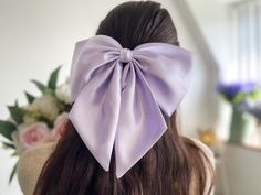 Large and Luxurious Silk Satin with tails hair bow for girls They are handmade with love and care using high quality fabric.  The bow measures  24.50 cm or 9 1/2" in width appx  12 cm or 4 3/4" in height  Tail is 18 cm or 7" long  Attachment: Barrette (Available in other attachments. Please message me)  *Please be noted that the color might appear a little differently on each phone, tablet, or computer screen. Adjustable Satin Bow Hair Accessories For Wedding, Cute Hair Accessories With Satin Bow For Gifts, Elegant Adjustable Satin Bow, Purple Bow Hairstyle, Purple Hair Bow, Giant Bow, Large Hair Bows, Purple Bows, Handmade Hair Accessories