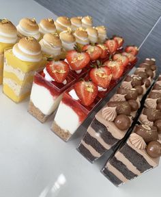 a table topped with lots of different types of desserts