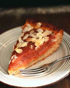 a piece of pie on a plate with a fork