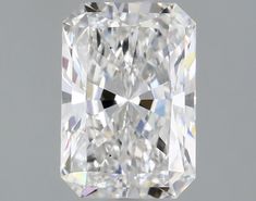 a cushion cut diamond on a gray background