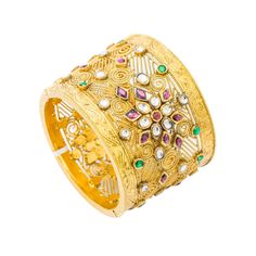 Blend art and luxury with this confection of Kundan designs and radiant gold with this 22K yellow antique gold bangle cuff from Virani Jewelers!! Features: • Antique-finished 22K yellow gold • Brilliant Kundan • Heavy detailed bangle cuff Virani Jewelers has set the bar on luxury jewelry and fine 22K gold pieces. This exquisite 22K yellow antique gold bangle cuff is beautifully embellished in an artistic display of Kundan. The embellishments are seamlessly placed atop a heavily detailed wide ban Hand Set Yellow Gold Chandbali Bangle, Festive Intricate Cuff Bangle Bracelet, 22k Gold Bracelets With Intricate Design For Festive Season, Festive 22k Gold Hand Set Bangle, Festive 22k Gold Hand-set Bangle, Yellow Gold Cuff Bracelet With Intricate Design For Wedding, Wedding Cuff Bracelet In Yellow Gold With Intricate Design, Fusion Style Wedding Cuff Bracelet With Intricate Design, Wedding Yellow Gold Cuff Bracelet With Intricate Design